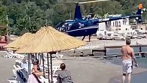 Bunu da gördük! Otele yemeğe gelenler halk plajına helikopterle indi